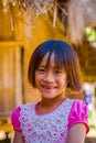 CHIANG RAI, THAILAND - FEBRUARY 01, 2018: Close up of unidentified smiling little girl belongs to a Karen Long Neck hill Royalty Free Stock Photo