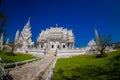 CHIANG RAI, THAILAND - FEBRUARY 01, 2018: Outdoor view of stoned path with a gorgeous ornate of white temple located in