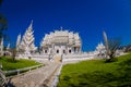 CHIANG RAI, THAILAND - FEBRUARY 01, 2018: Outdoor view of stoned path with a gorgeous ornate of white temple located in