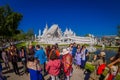 CHIANG RAI, THAILAND - FEBRUARY 01, 2018: Unidentified people walking to visit the beautiful ornate white temple located