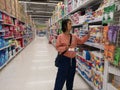 CHIANG RAI, THAILAND - MARCH 7, 2019 : Unidentified asian customer looking for toilet paper on shelf in supermarket on March 7,