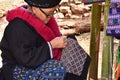 Unidentified female Mien hilltribe embroider pattern colored thread at Doi Mae Salong