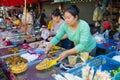 Saleswoman of hot waffles at a street market, Thailand