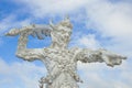 Sculpture of a demon guarding the entrance to the Buddhist temple Wat Rong Khun