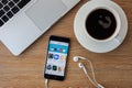 CHIANGMAI,THAILAND - FEBRUARY 5, 2015: Brand new Apple iPhone 5S with iTunes store application on the screen lying on a desk.