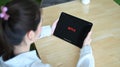 CHIANGMAI, THAILAND: JULY 27, 2020 : Woman open Netflix on New iPad 2020, Netflix is an international leading subscription.