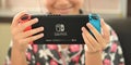 CHIANGMAI, THAILAND - 2 May 2020, Girl playing game on Nintendo Switch console. Royalty Free Stock Photo