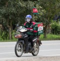 Delivery service man ride a Motercycle of The Pizza Company. Royalty Free Stock Photo