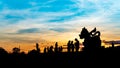 Silhouette Image of The statue of golden lion on a field with blue sky background at sunset or evening time, at Singha park Chiang