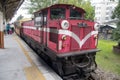 Red retro train travels between Chiayi and Alishan stop at Chiayi station in Taiwan