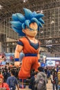 Huge inflatable structure of Son Goku character standing at Jump Festa.