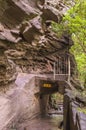 Buddhist statues in a cavity named Gomakutsu above a tunnel of the hiking path of Mount Nokogiri. Royalty Free Stock Photo