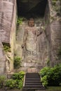 Hyaku-shaku kannon buddha carved in excavated stone wall cavity of Mount Nokogiri stone quarry. Royalty Free Stock Photo