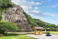 Side angle view of the giant buddha Daibutsu Yakushi of Nihonji temple in Mount Nokogiri. Royalty Free Stock Photo