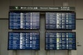 View of Flight schedule information boards at Narita International Airport, Chiba, Japan