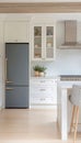 Chic Blue Modern Refrigerator with Timeless White Cabinets in a Contemporary Kitchen Design Royalty Free Stock Photo