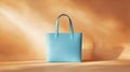 A chic and bold light blue tote bag centered on a pale sandy Royalty Free Stock Photo