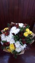 Chic bouquet of chrysanthemum amid wood