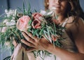 Chic bouquet of flowers hands young girl