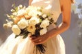 a chic bouquet in the hands of a bride in a white dress. Luxury wedding bouquet.