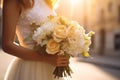 a chic bouquet in the hands of a bride in a white dress. Luxury wedding bouquet.