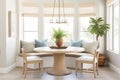 a chic breakfast nook with a round wooden table Royalty Free Stock Photo