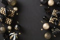 Chic Christmas flat lay composition with elegant black and gold elements. Luxury festive decor on a dark background. Modern design