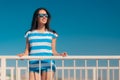 Beautiful summer fashion girl in navy striped shirt and sunglasses Royalty Free Stock Photo