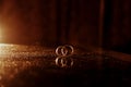 chic gold rings close-up on the table of the newlyweds