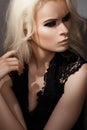 Chic rock style. Fashion blond model with make-up