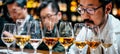Chic urban whisky tasting with diverse enthusiasts under stylish edison bulb lighting