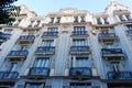 Chic vintage facade in faded blue colour in historical downtown in Chueca district, old center of Madrid, Spain