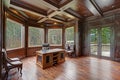 Chic Wood Paneled Home office features coffered ceiling Royalty Free Stock Photo