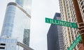 Chicago city skyscrapers, Illinois street and Wabash avenue crossing green signs Royalty Free Stock Photo