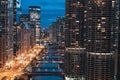 Chicago, Illinois. Cityscape, skyline at night with marina city tower, river, empty road and bridge in sight. Taken from London Ho Royalty Free Stock Photo