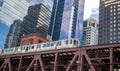 Chicago train on a bridge, skyscrapers background, low angle view Royalty Free Stock Photo