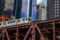 Chicago train on a bridge, skyscrapers background, low angle view Royalty Free Stock Photo