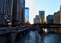 Chicago downtown during evening commute as an El train passes over Chicago River. Royalty Free Stock Photo