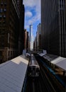 Chicago elevated `el` brown line train entering station located at the Adams Street and Wabash Avenue station in the downtown area Royalty Free Stock Photo