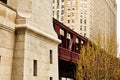 Chicago elevated el train moving along Wells Street tracks during spring blooming season Royalty Free Stock Photo