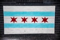 Chicago flag painted on black bricks