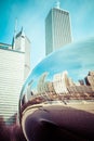 CHICAGO, IL - APRIL 2: Cloud Gate and Chicago skyline on April 2, 2014 in Chicago, Illinois. Cloud Gate is the artwork of Anish Royalty Free Stock Photo