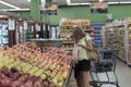 Chicago,IL- August 21, 2021:Mother and child wearing masks shopping at supermarket for editorial use only