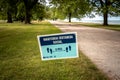 Chicago, IL - June 23rd, 2020: Chicago Park District posted signs in Spanish for the Hispanic population along lakefront for Royalty Free Stock Photo