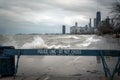 Chicago, IL - March 20th, 2020: Blue wooden police barricades block off the lakefront trail and bike path due to high winds and