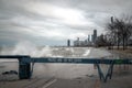 Chicago, IL - March 20th, 2020: Blue wooden police barricades block off the lakefront trail and bike path due to high winds and