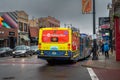 Chicago, IL - November 30th, 2019: The annual CTA holiday bus with Santa and elves aboard drives down Clark Street delighting both