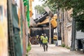 Chicago, IL - October 6th, 2021: Construction workers in hard hats gather in an alley after a construction pile driving drill rig Royalty Free Stock Photo