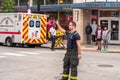 Chicago, IL - October 6th, 2021: A fireman helps direct traffic after a construction pile driving drill rig tips over while doing Royalty Free Stock Photo