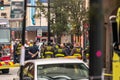 Chicago, IL - October 6th, 2021: Firemen and police officers talk in the street after a construction crane tips over doing work